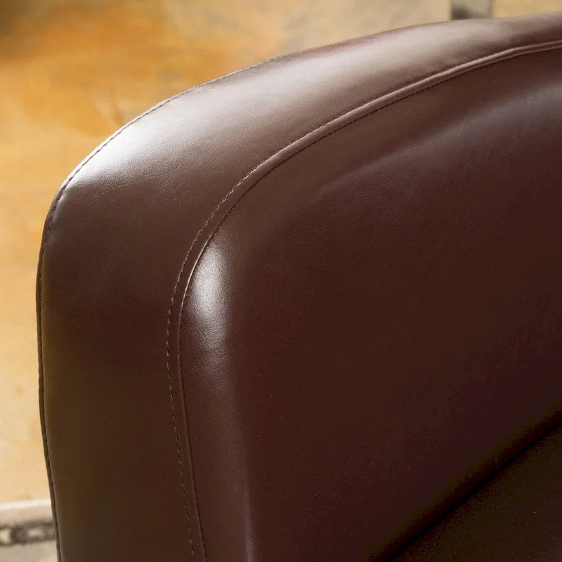 Fauteuil club pivotant à oreilles Angelo en cuir reconstitué