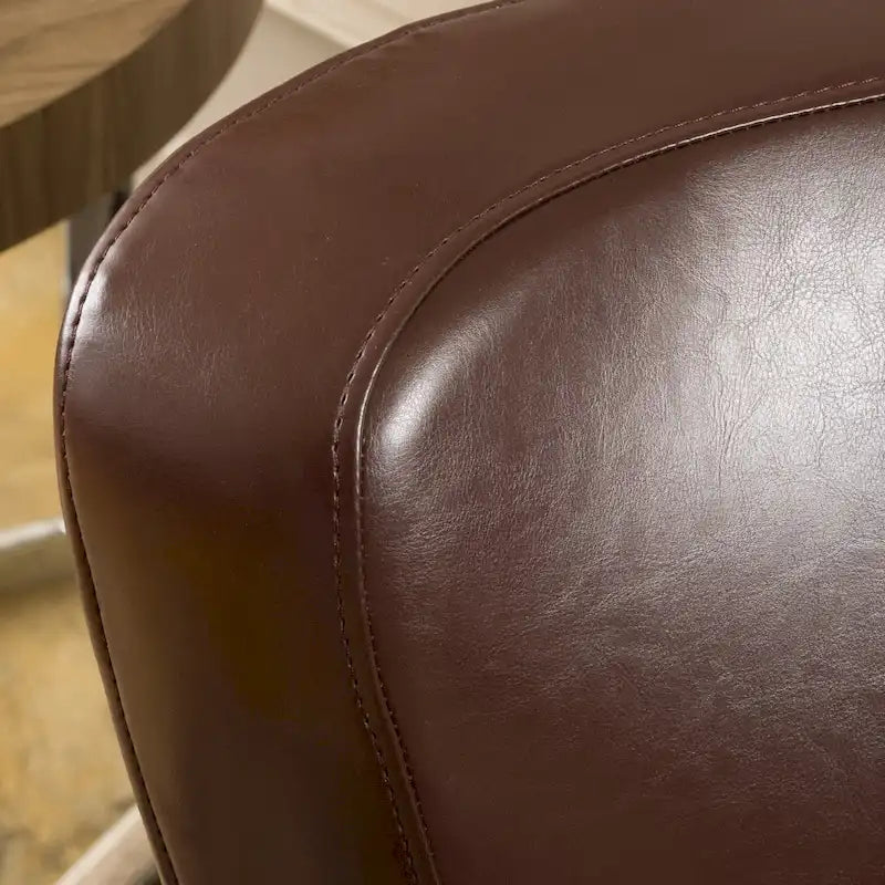Fauteuil club pivotant à oreilles Angelo en cuir reconstitué
