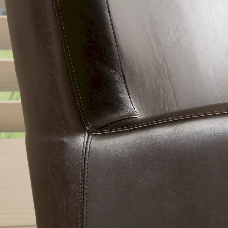 Fauteuil club pivotant à oreilles Angelo en cuir reconstitué